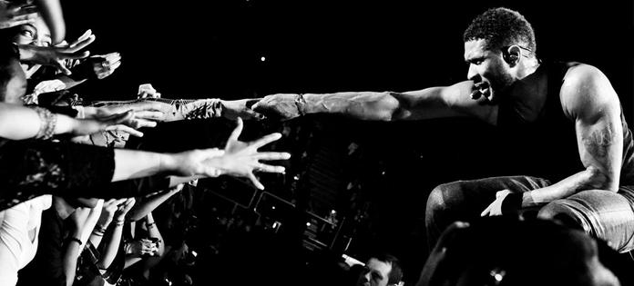 As if Usher can't get the ladies hot enough... He brings out these two guys..